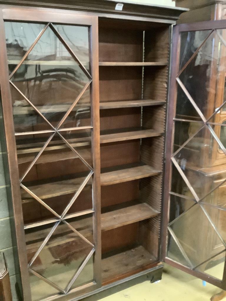 A George III mahogany bookcase with two astragal glazed doors, on later feet, width 116cm